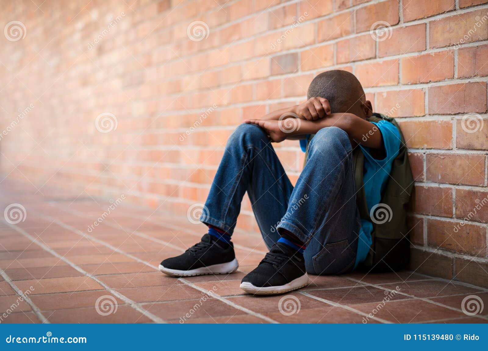 young sad boy at school