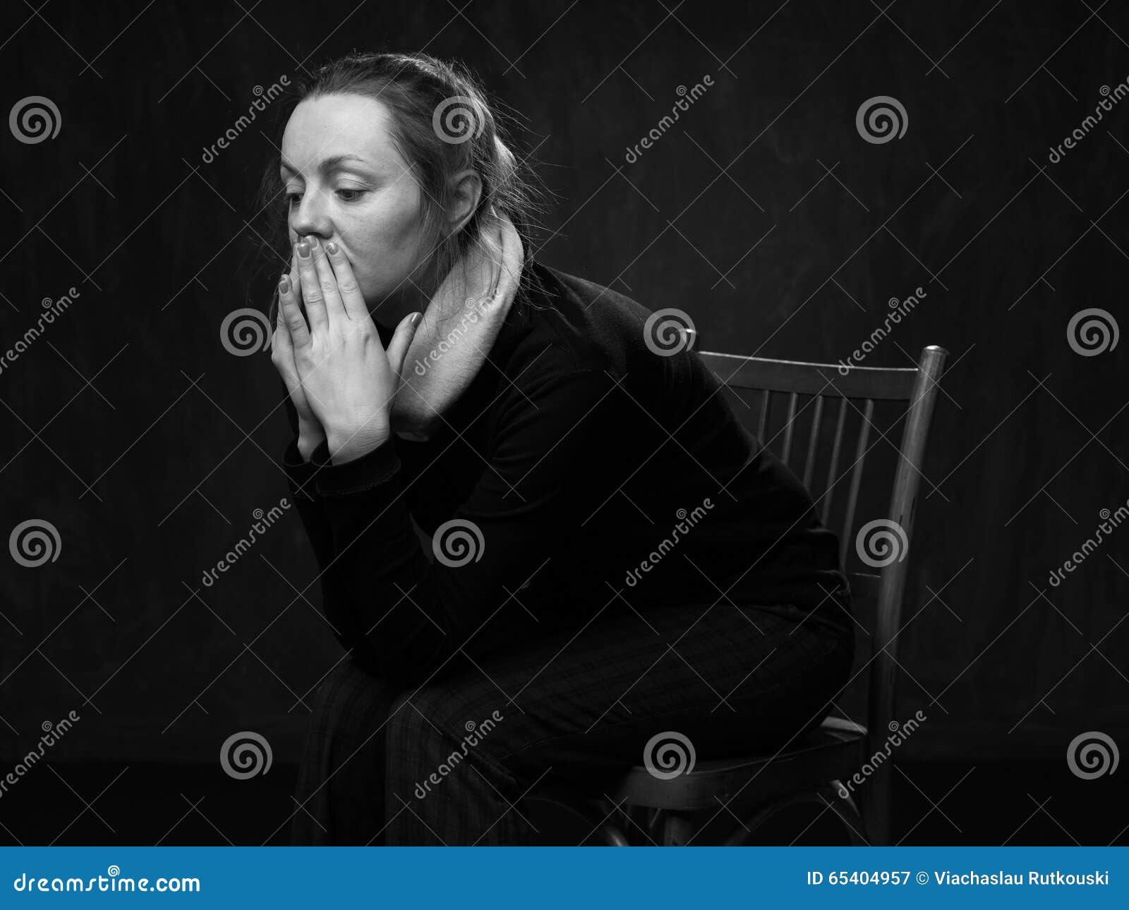 young sad disoriented woman sitting on the chair
