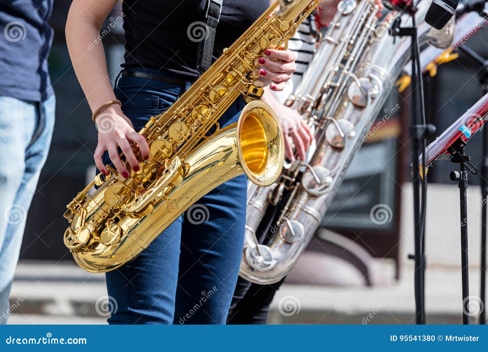 Young Saxophonists Playing Saxes during Street Performance Stock Photo