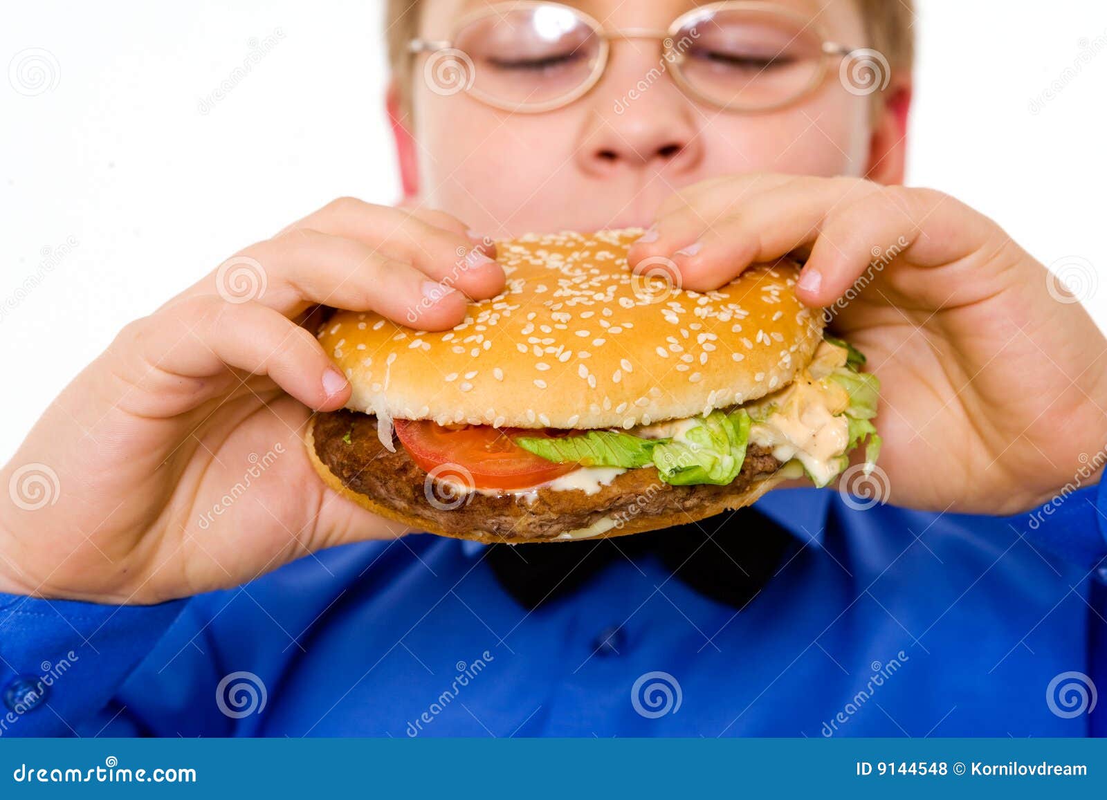 Young School Boy Eating Hamburger Stock Photo Image of hamburger