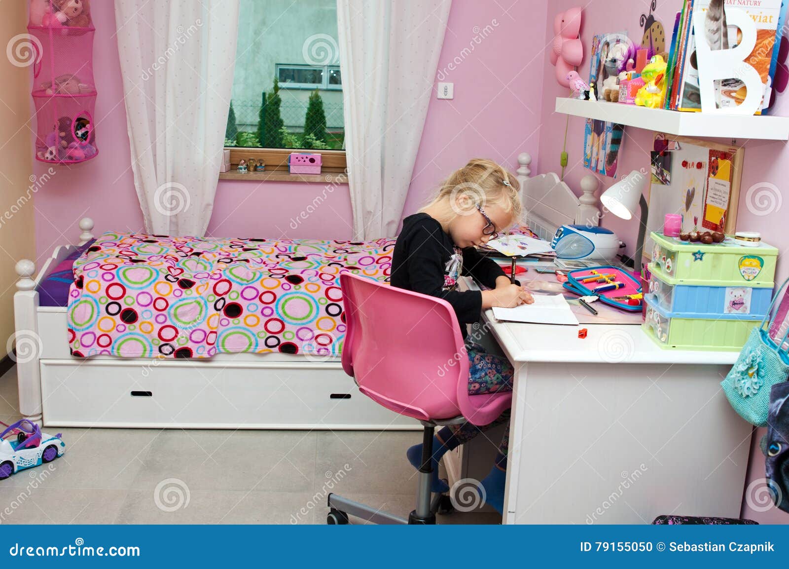 young schoolgirl doing homework