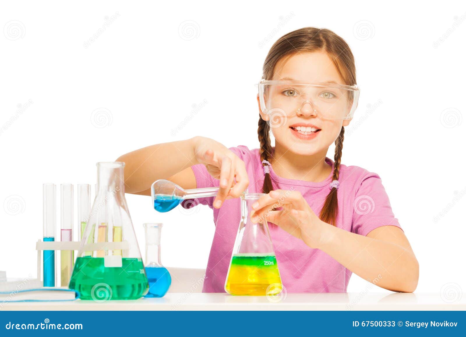 young schoolgirl mixing blue and yellow reactants
