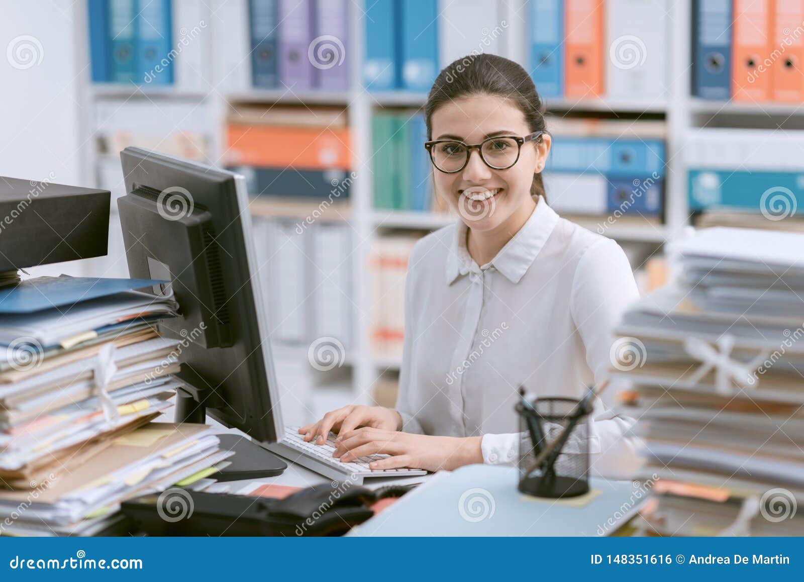 young secretary working and smiling