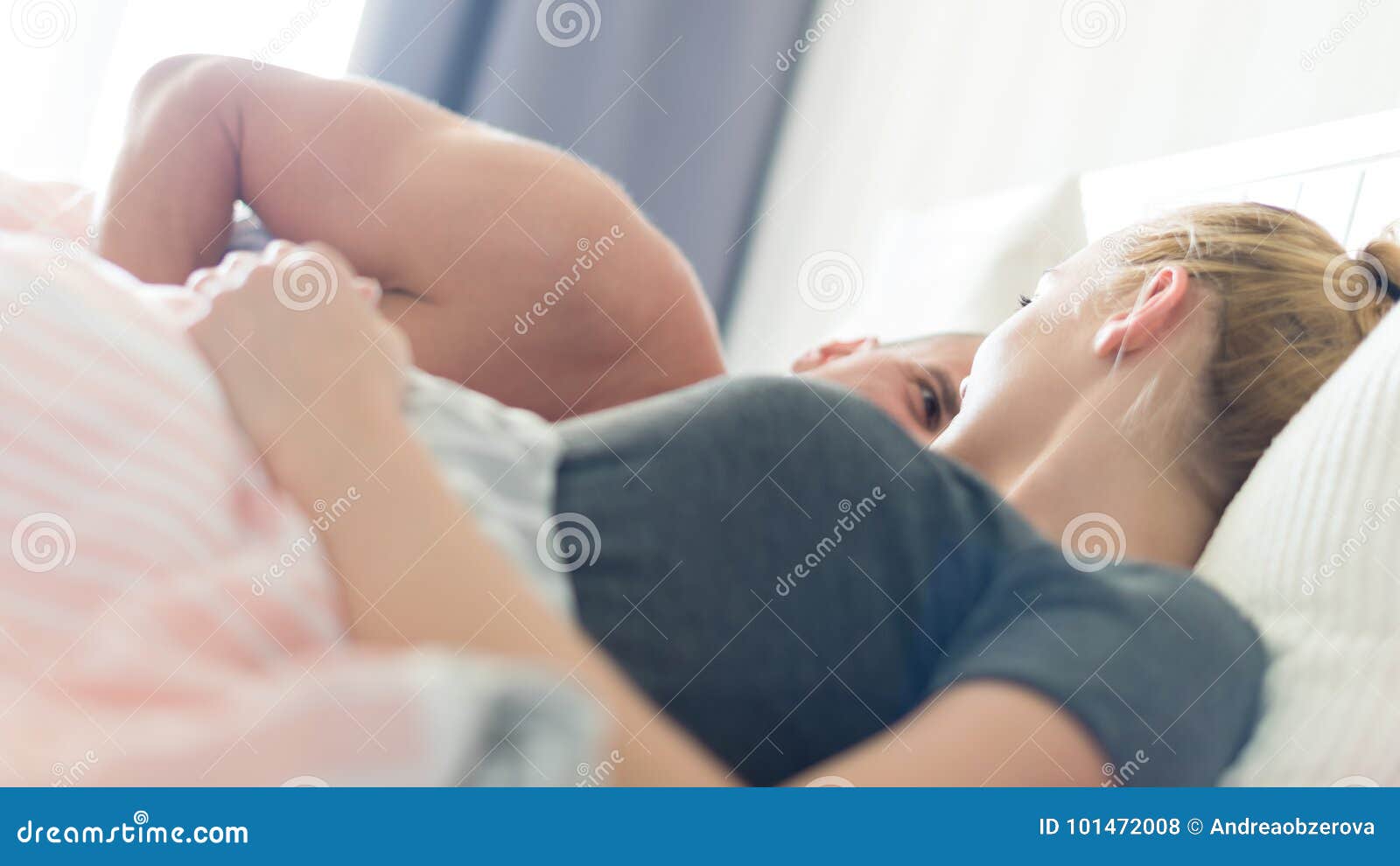 Young Sensual Couple in Their Bedroom Looking Lovingly at Each Other Stock Photo