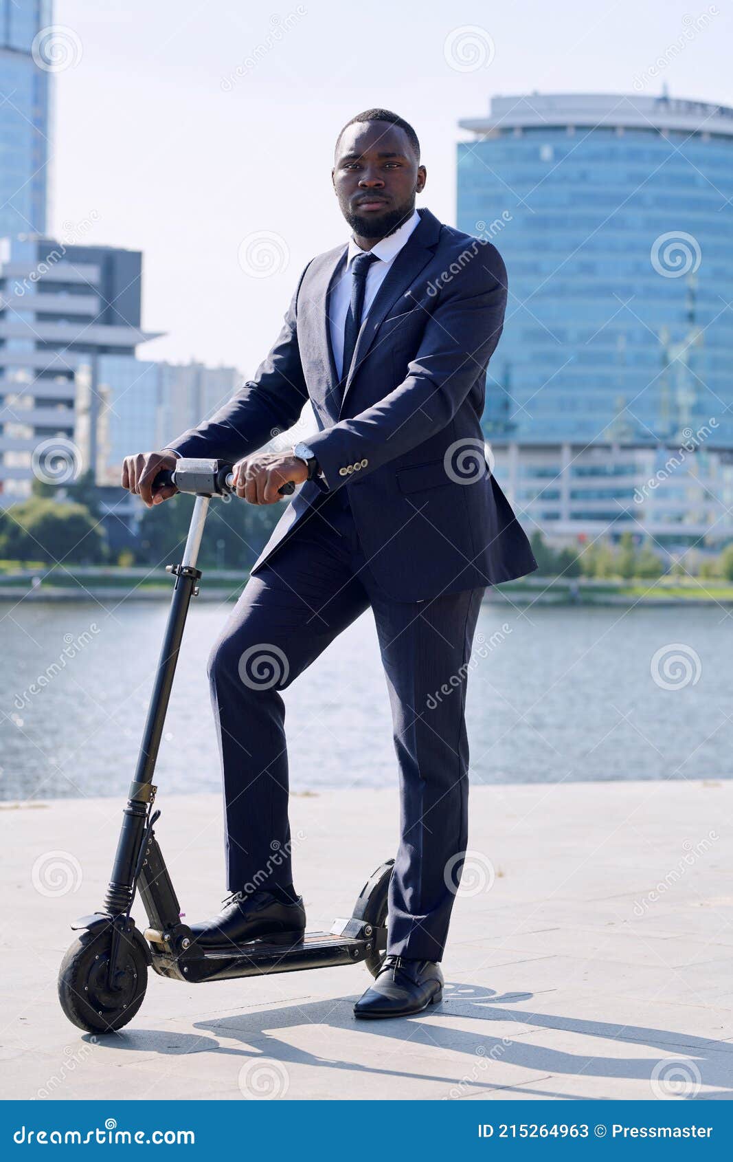 Converge Korn Med det samme Young Serious African Businessman in Formalwear Standing on Electric Scooter  by Riverside Stock Image - Image of business, formalwear: 215264963