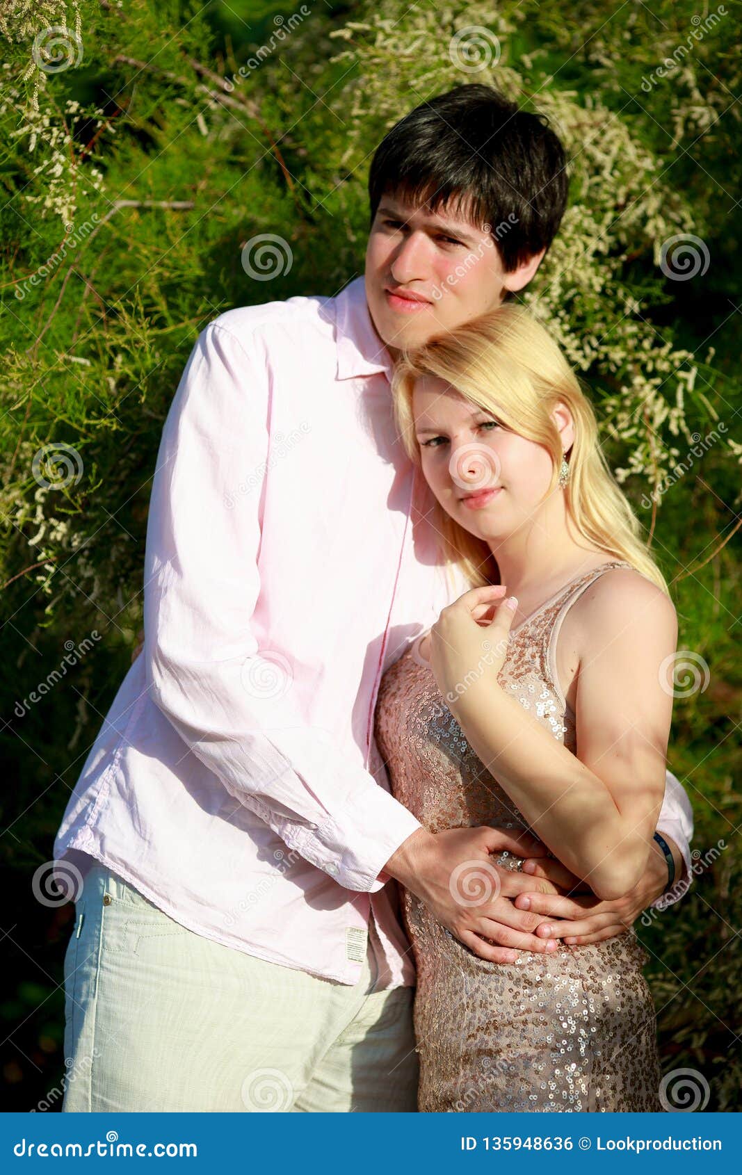 Young Blonde Woman and Man at Romantic Date at Vacation Stock Photo
