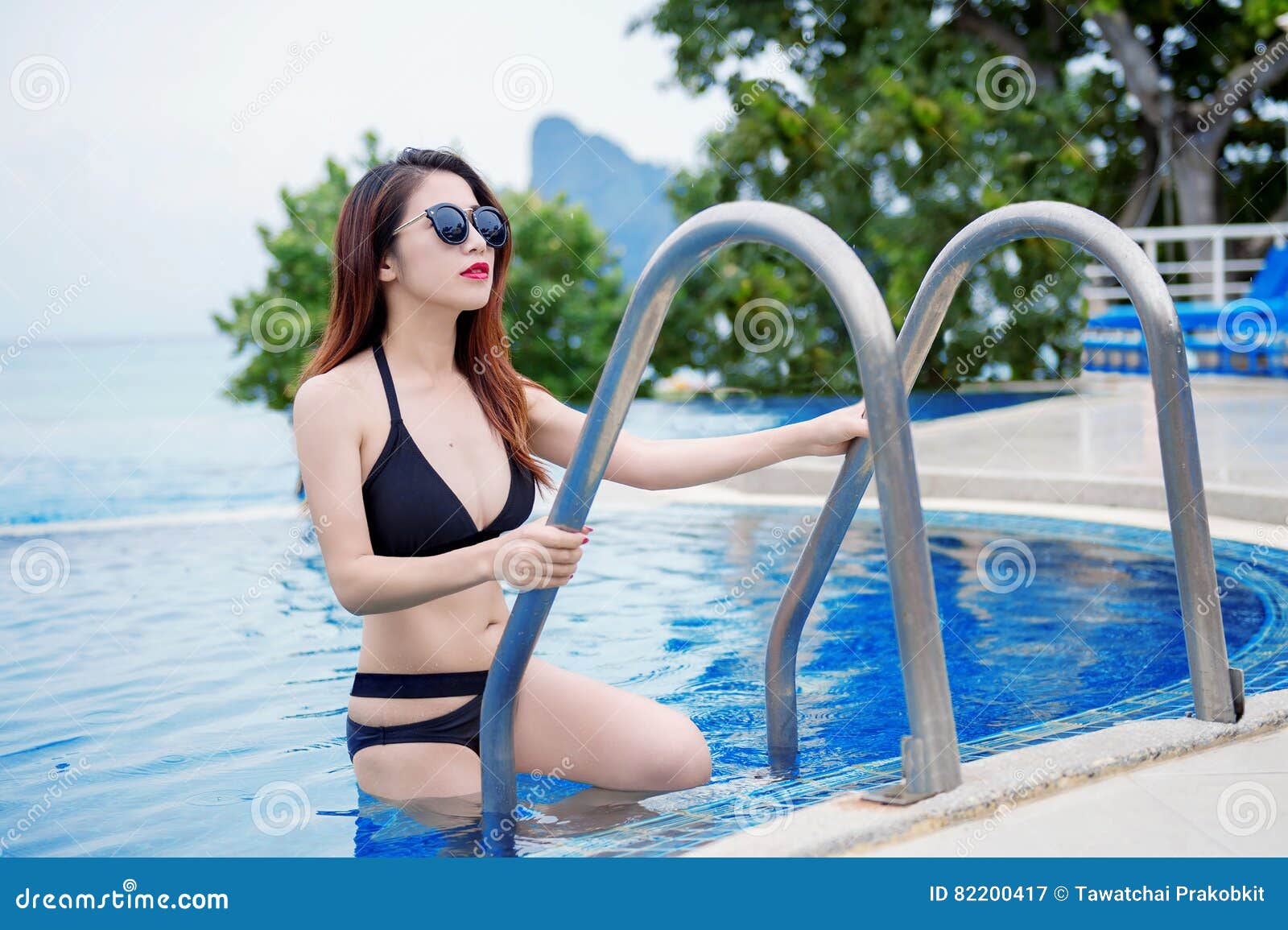 girl in bikini by indoor pool porn photo