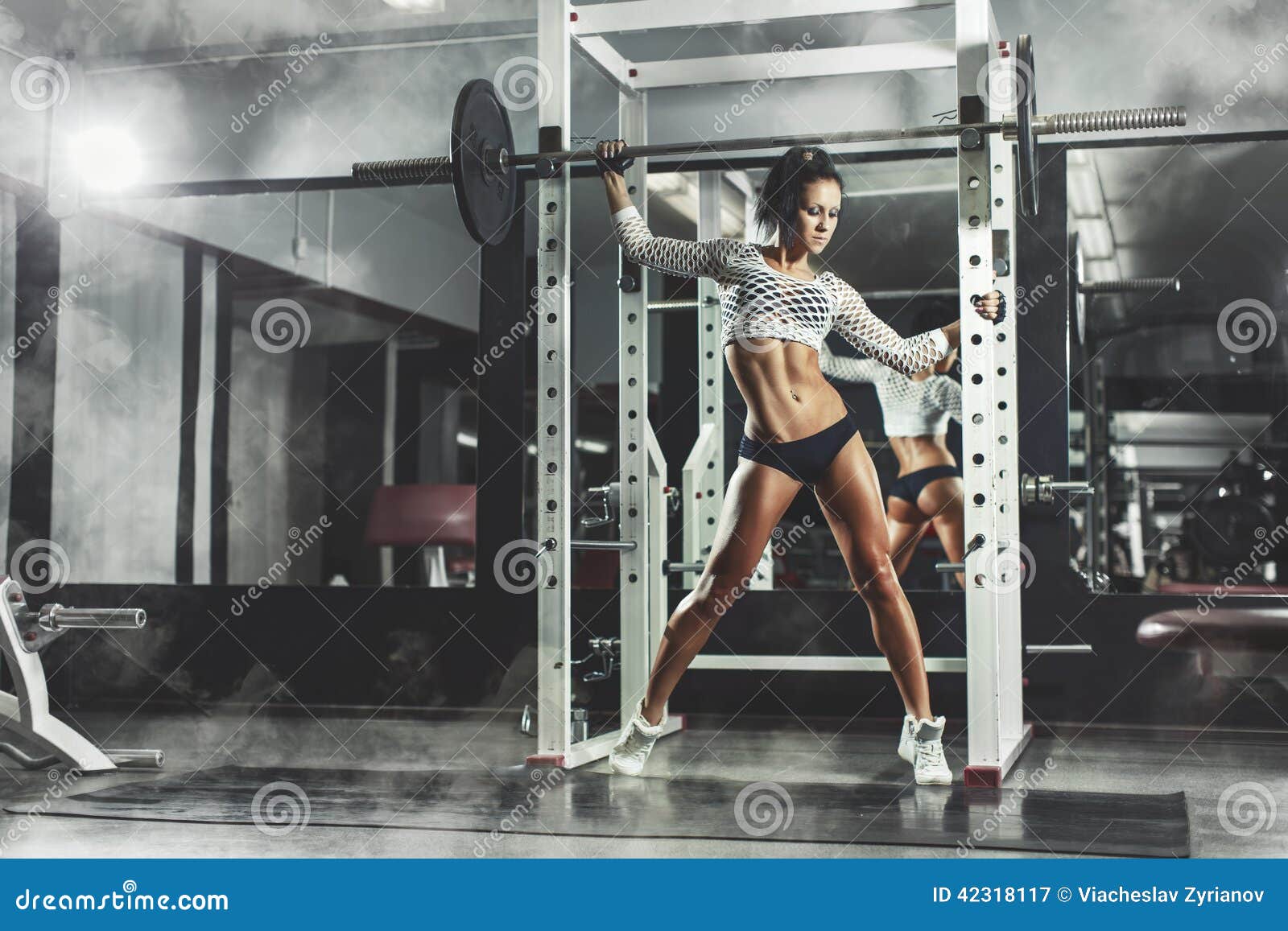 young sexy girl gym posing relaxing fitness smoke background 42318117