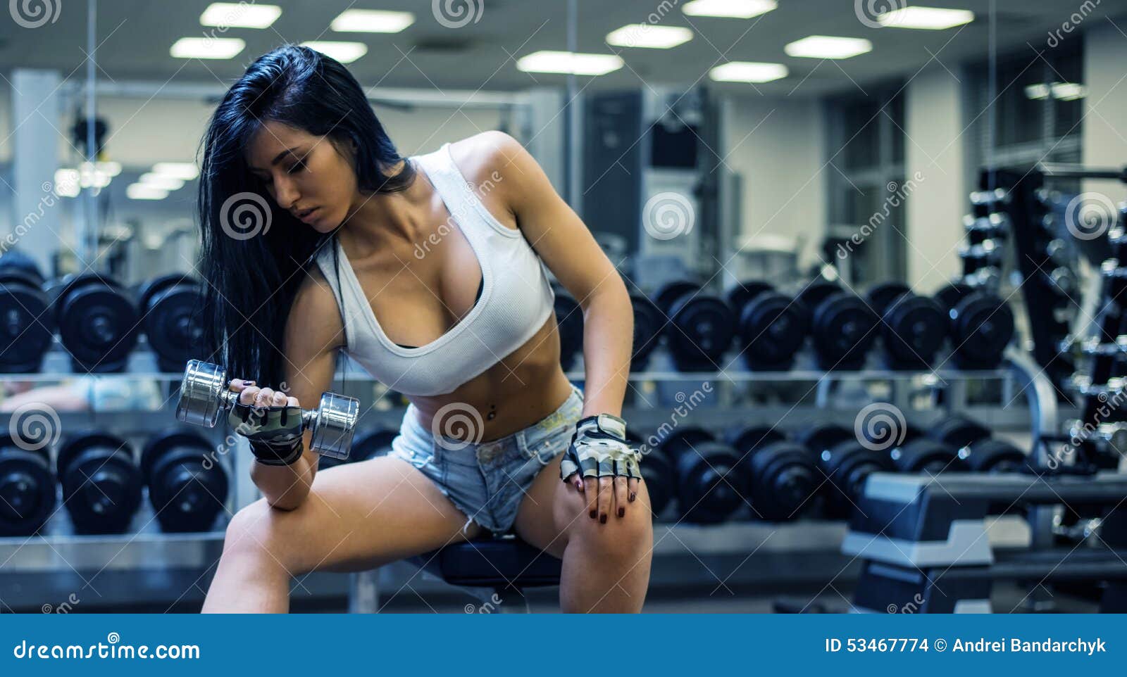 Young Sexy Girl In A Sports Gym Shorts And Tshirt For Sports Banco