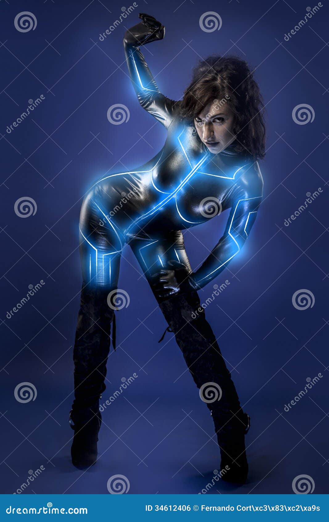 Young Latex Woman On Future Costume Blue Neon Lights Stock Photo