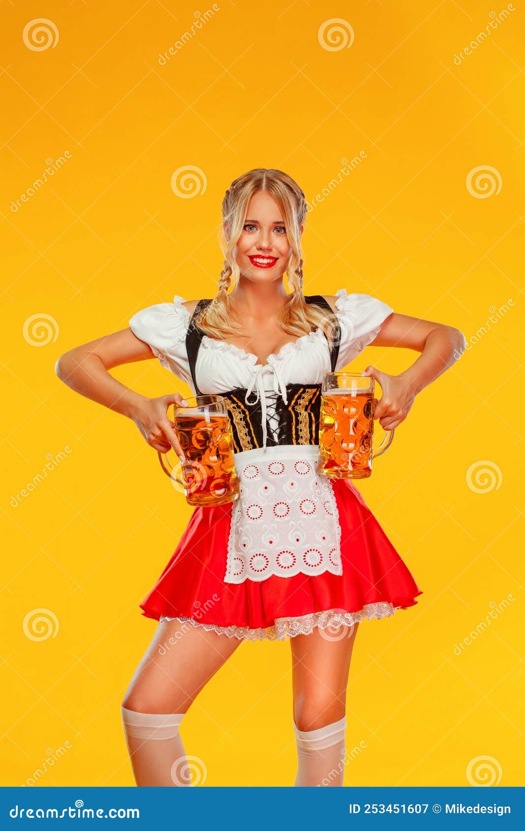 Young Oktoberfest Girl Waitress Wearing A Traditional Bavarian Or German Dirndl Woman Serving 