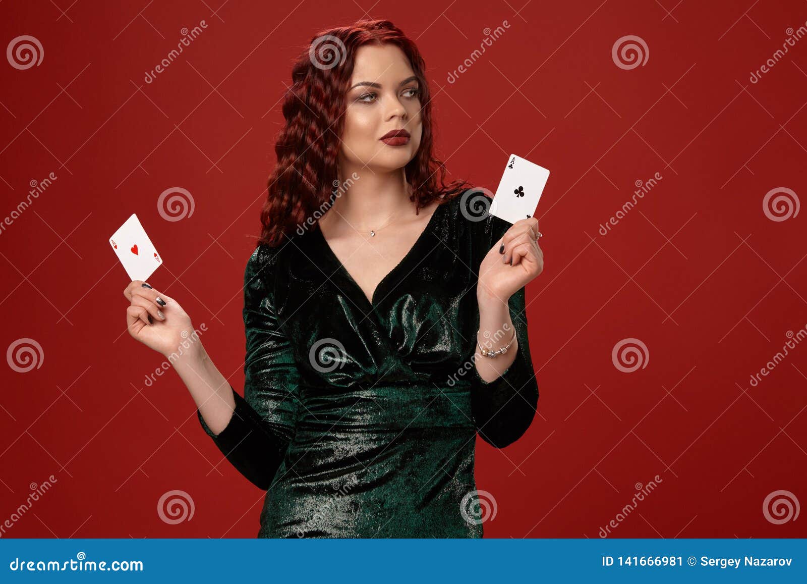 Young Woman With A Red Curly Hair Holding Aces, On A Red Background ...