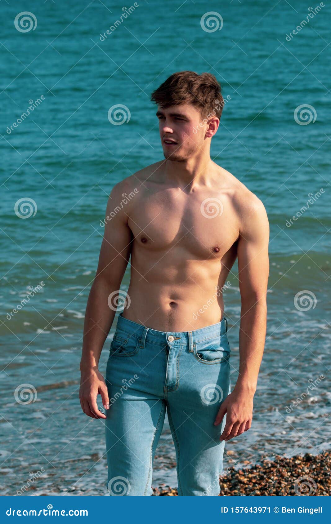 Shirtless on a beach stock image. Image of shirtless - 157643971