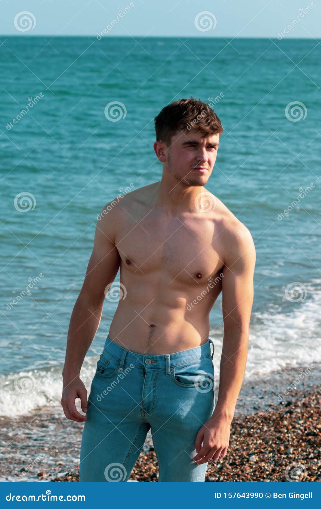 Shirtless on a beach stock photo. Image of bare, coast - 157643990