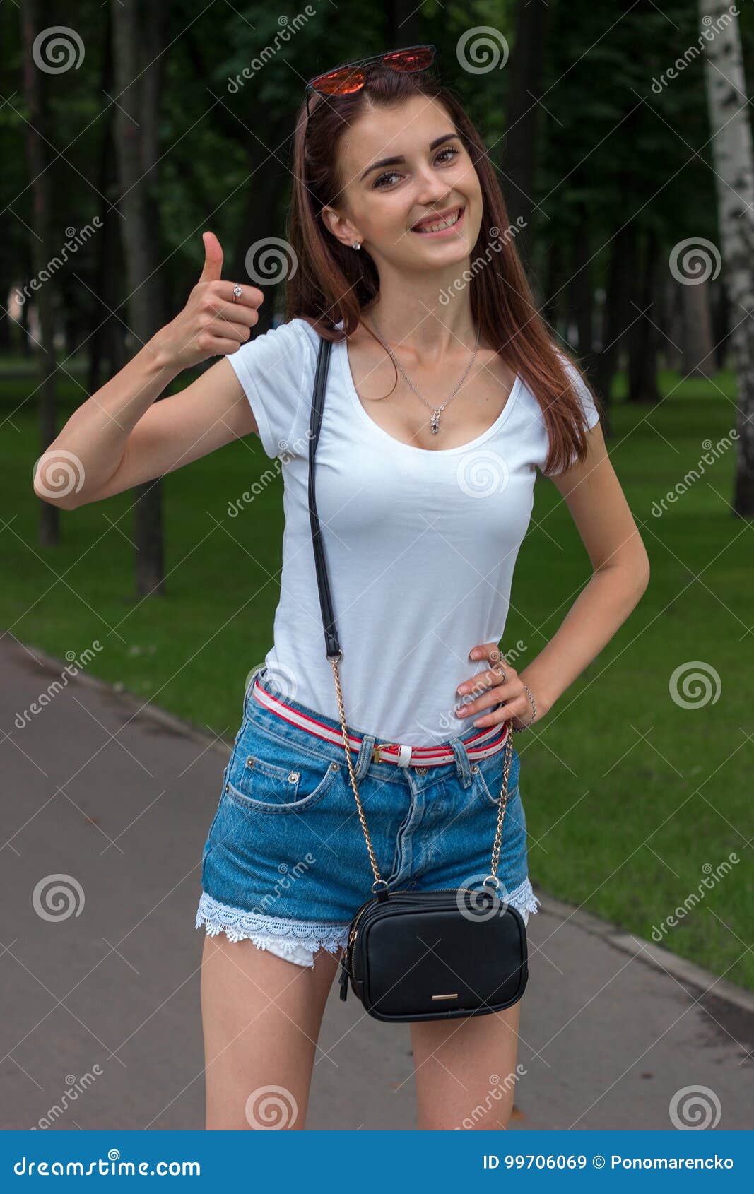 Young Skinny Beautiful Girl Stands in the Park and Smiling Stock Image -  Image of beauty, adult: 99706069