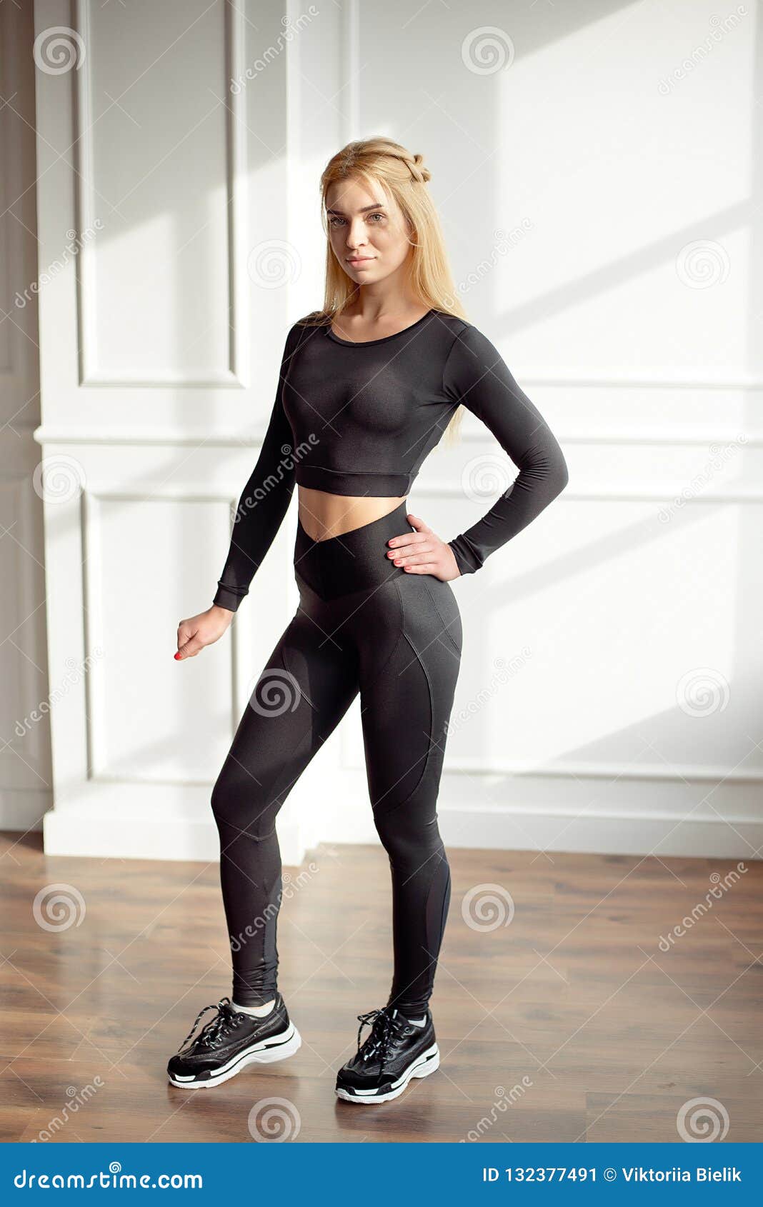 Young Slim Woman with an Athletic Body Long Blonde Hair Wearing in