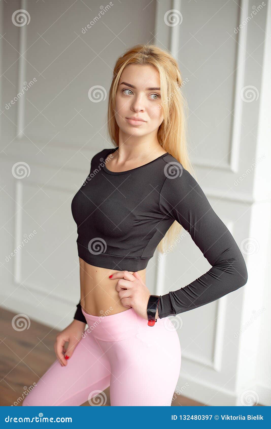 Young Slim Woman with an Athletic Body Long Blonde Hair Wearing in Black  Sports Sportswear Top and Pink Leggings Stock Image - Image of exercise,  sporty: 132480397