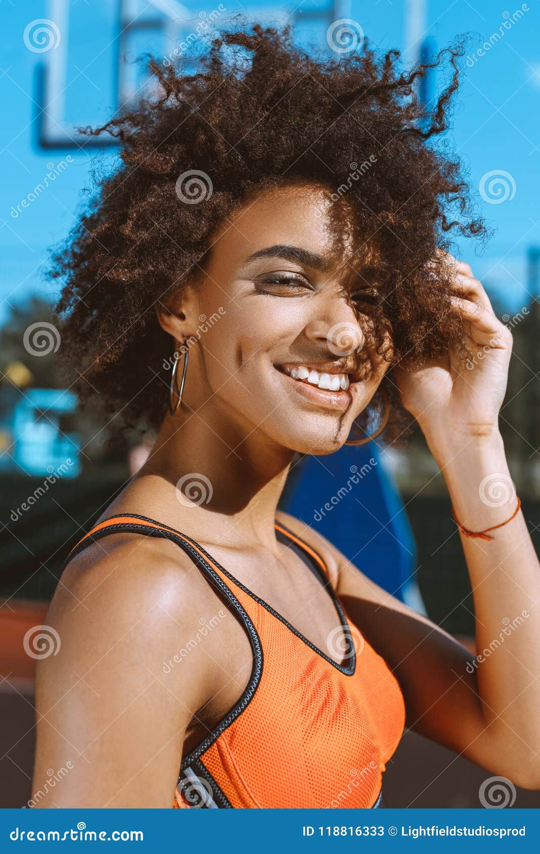Young Smiling African-american Woman in Bright Sports Bra Posing