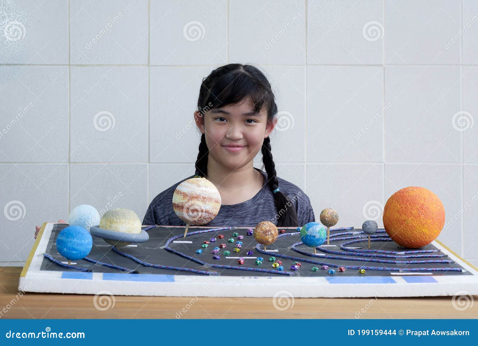 Asian Girl Showing Her Homemade Solar System Model For Science Homework Project Stock Photo Image Of Education Elementary