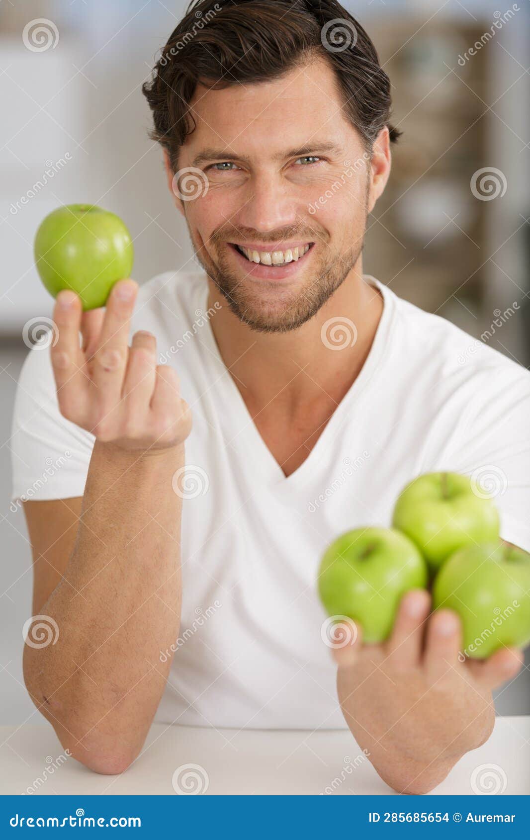 Young Smiling Man Holding Green Apples Stock Photo Image of breakfast