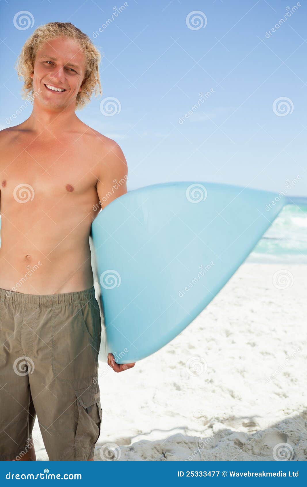 Young Smiling Man Holding His Blue Surfboard Stock Image - Image of ...