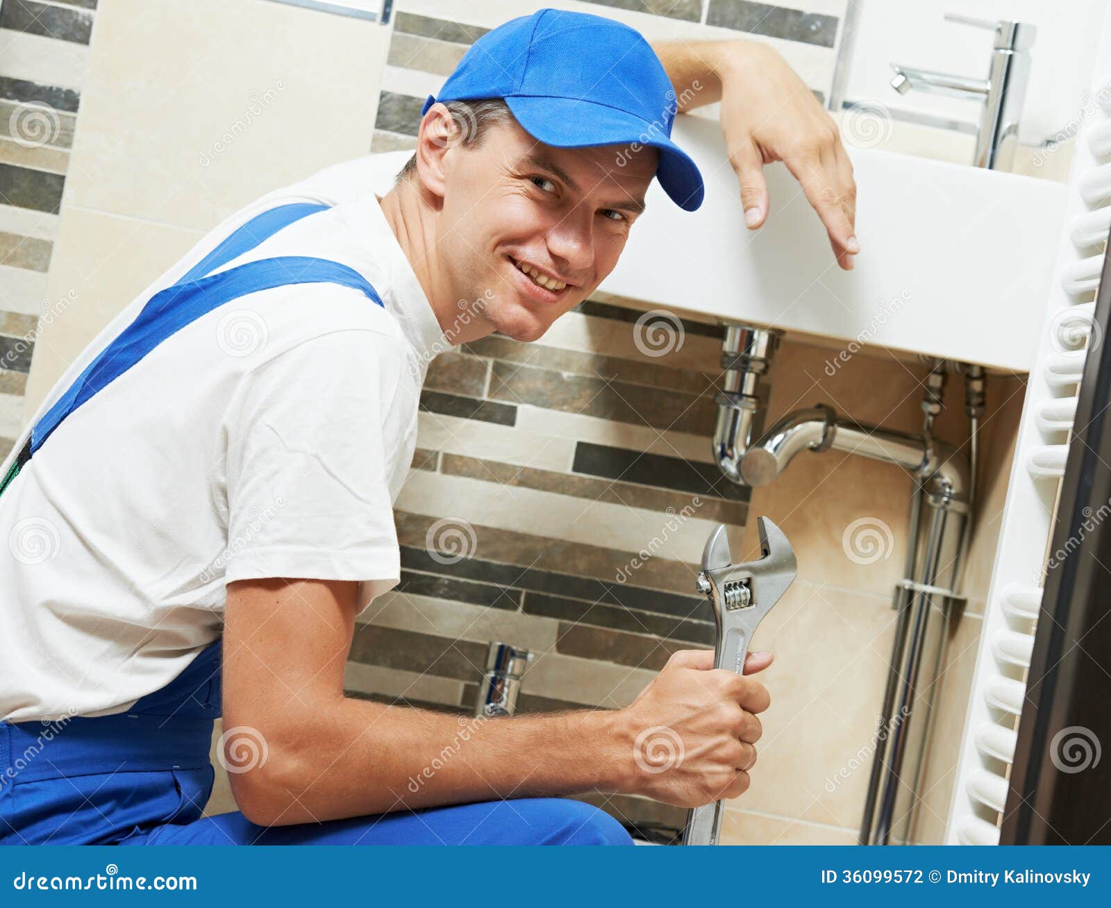 young-smiling-plumber-man-worker-happy-spanner-sanitary-washbasin-installation-system-36099572.jpg