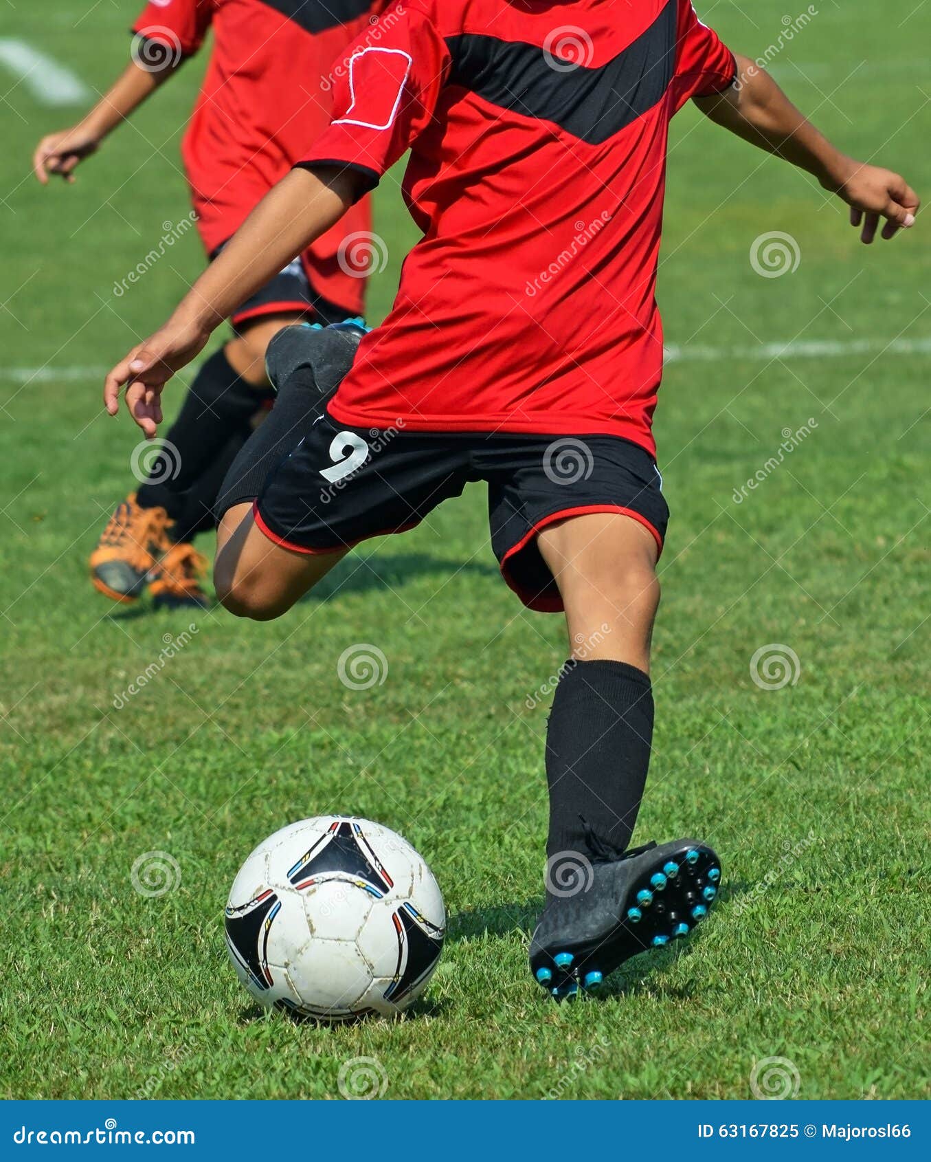 Young Soccer Player Kicks the Ball Stock Image Image of playing