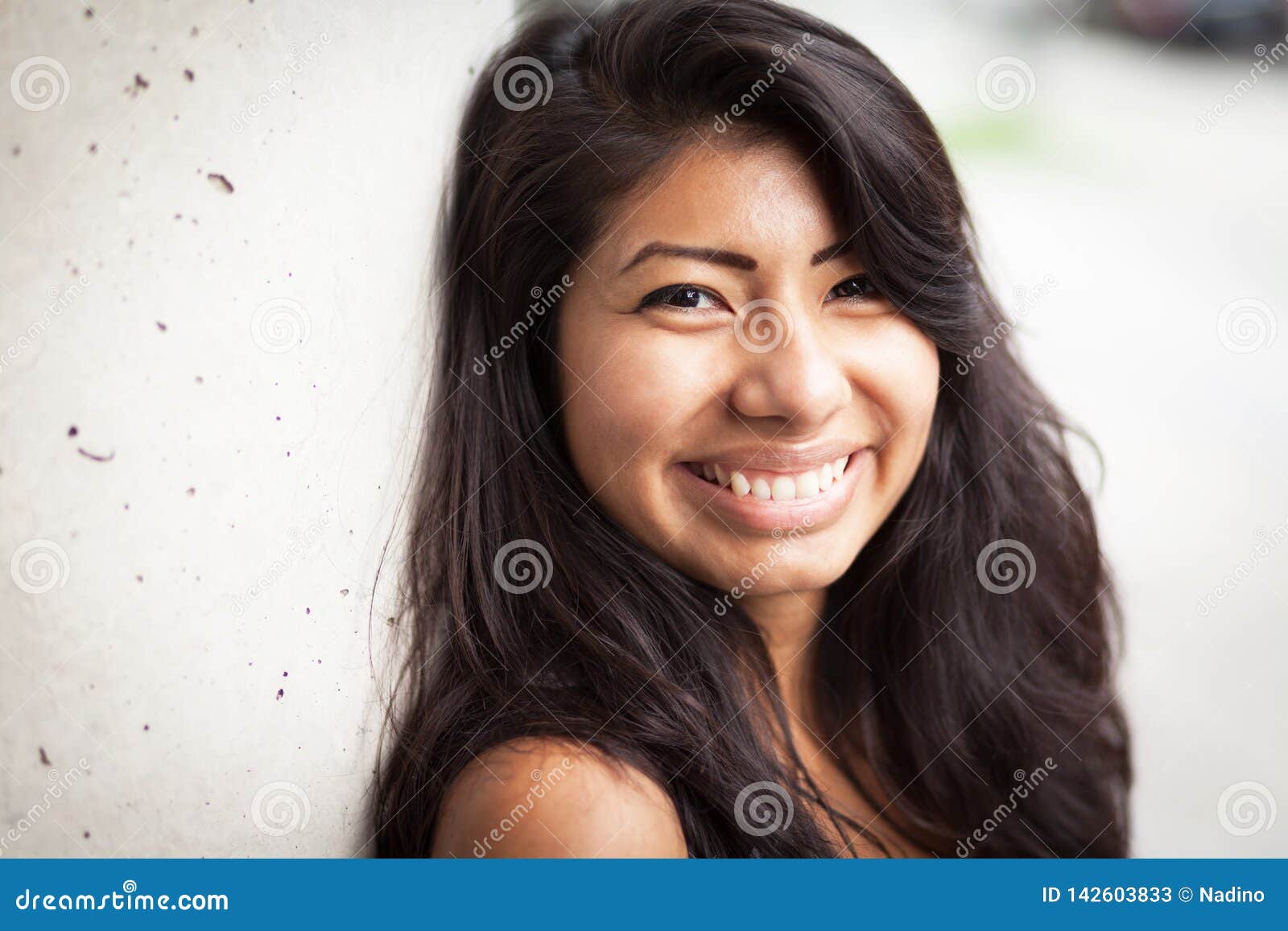 Young Spanish Woman Smiling At The Camera. She Is Leaning ...