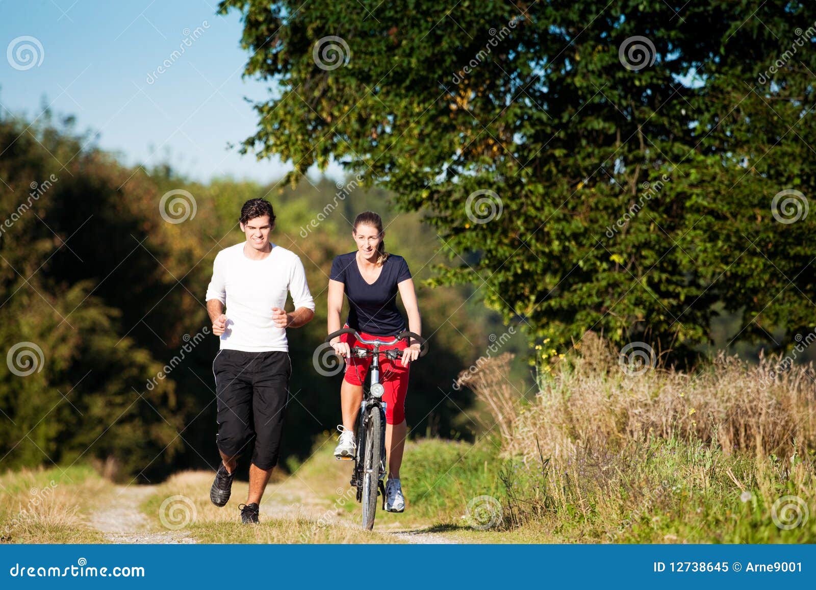 Young Sport Couple Jogging And Cycling Royalty Free Stock Photo within cycling or jogging with regard to Provide Household