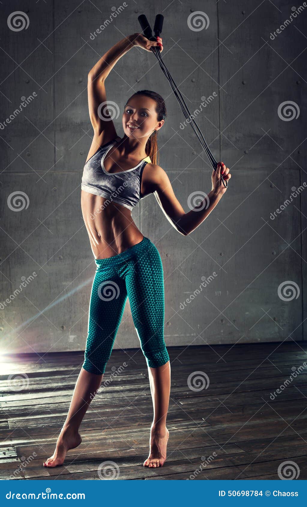 https://thumbs.dreamstime.com/z/young-sports-woman-sexy-fitness-skipping-rope-wall-background-50698784.jpg