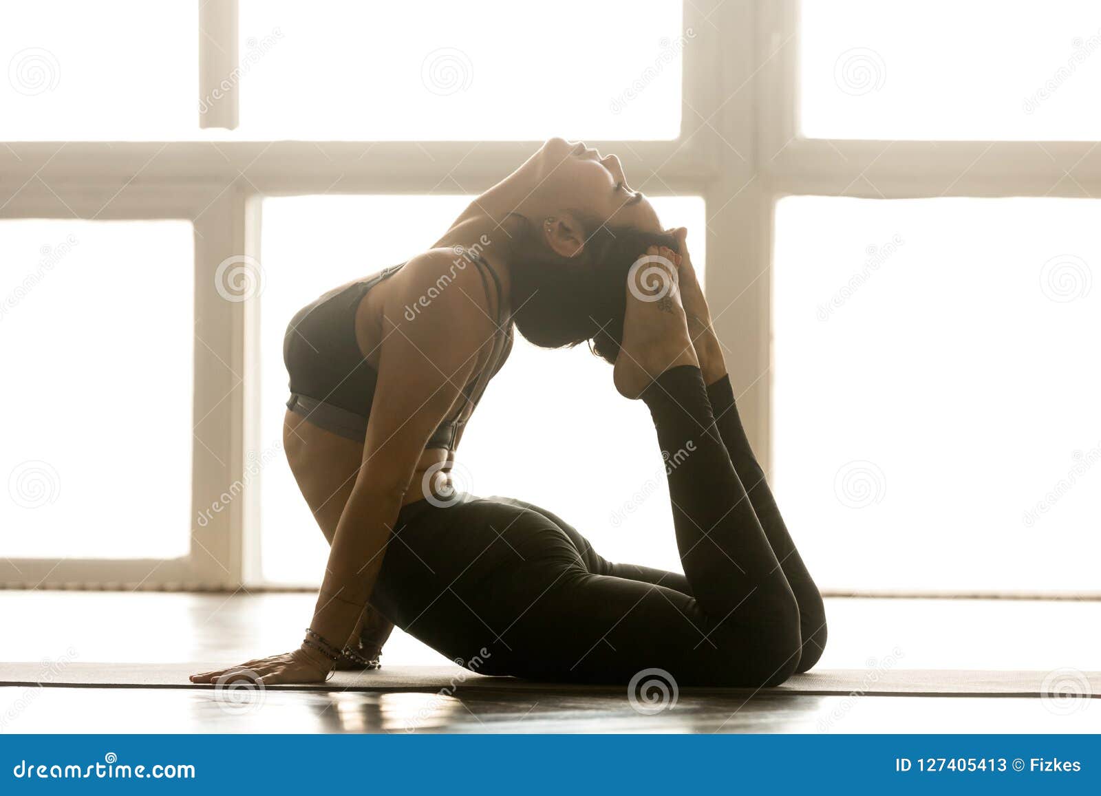 Young Sporty Woman Practicing Yoga, Doing Warrior Three 
