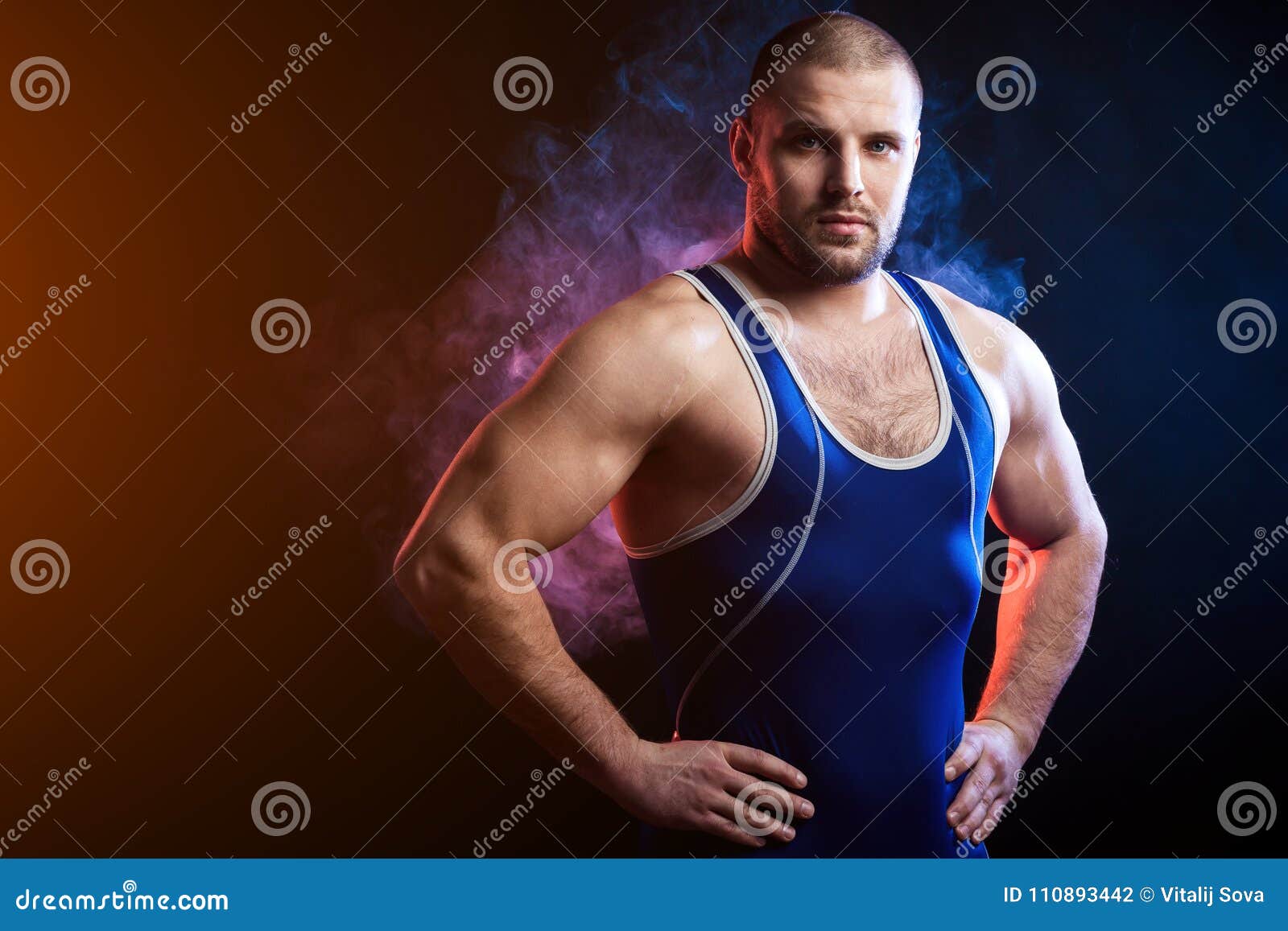 https://thumbs.dreamstime.com/z/young-sporty-man-wrestler-green-sports-shirt-blue-wrestling-tights-confidently-stands-keeps-his-hands-waist-110893442.jpg