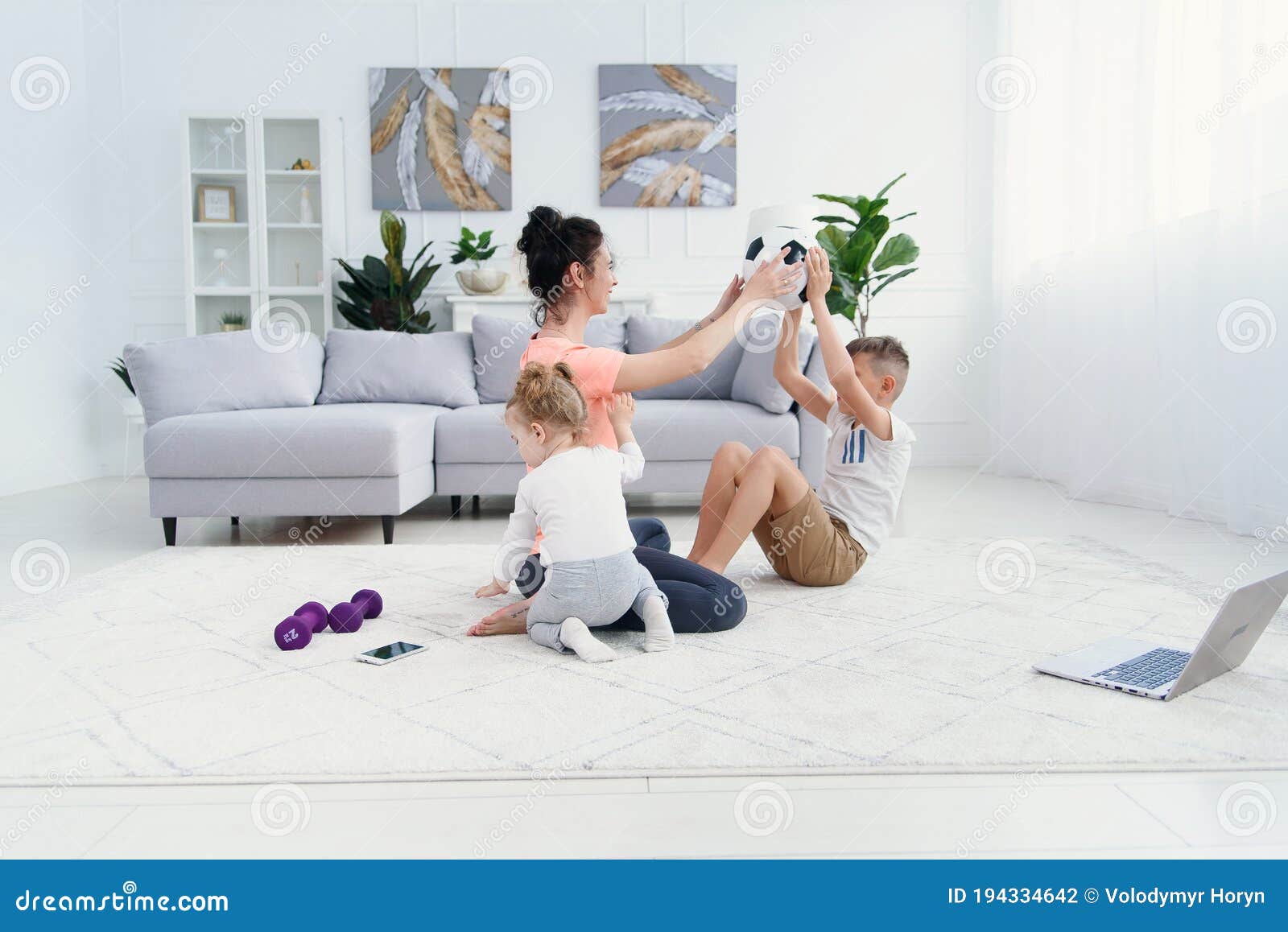 Young Sporty Mom With Her Kids Doing Morning Work Out Exercises At Cozy Home Healthy Family Lifestyle Concept Stock Photo Image Of Morning Child