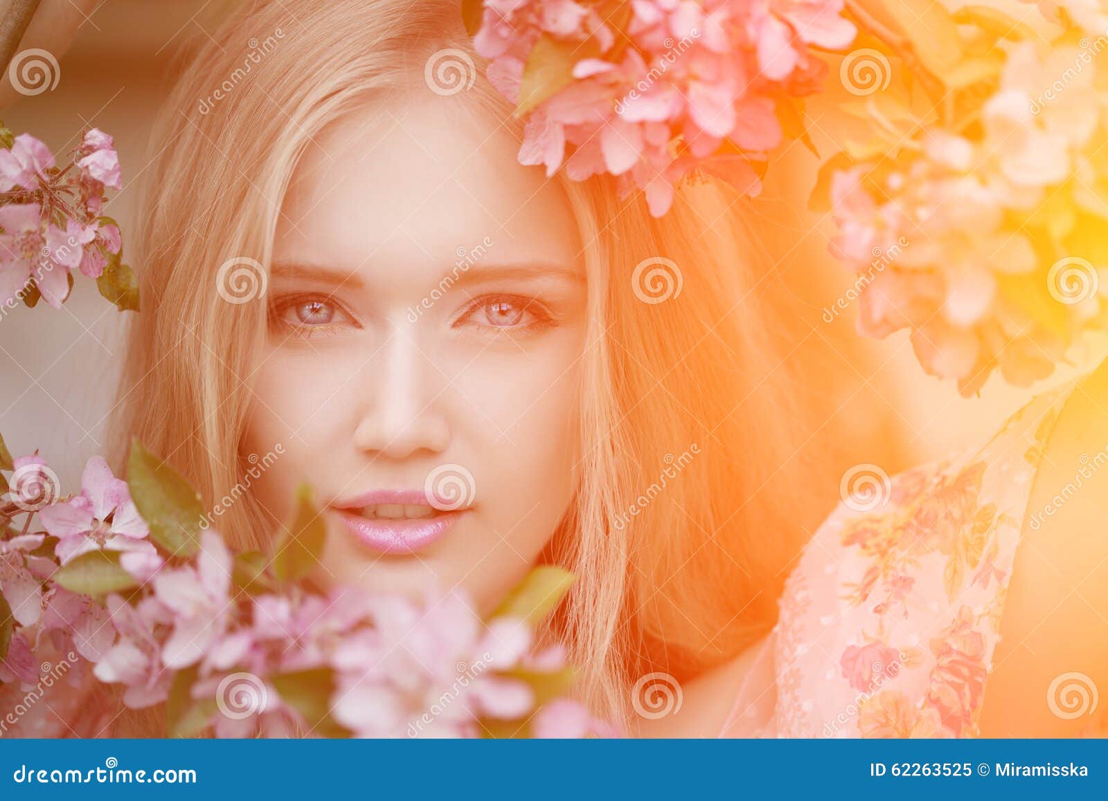 young spring fashion woman in spring garden. springtime. trendy