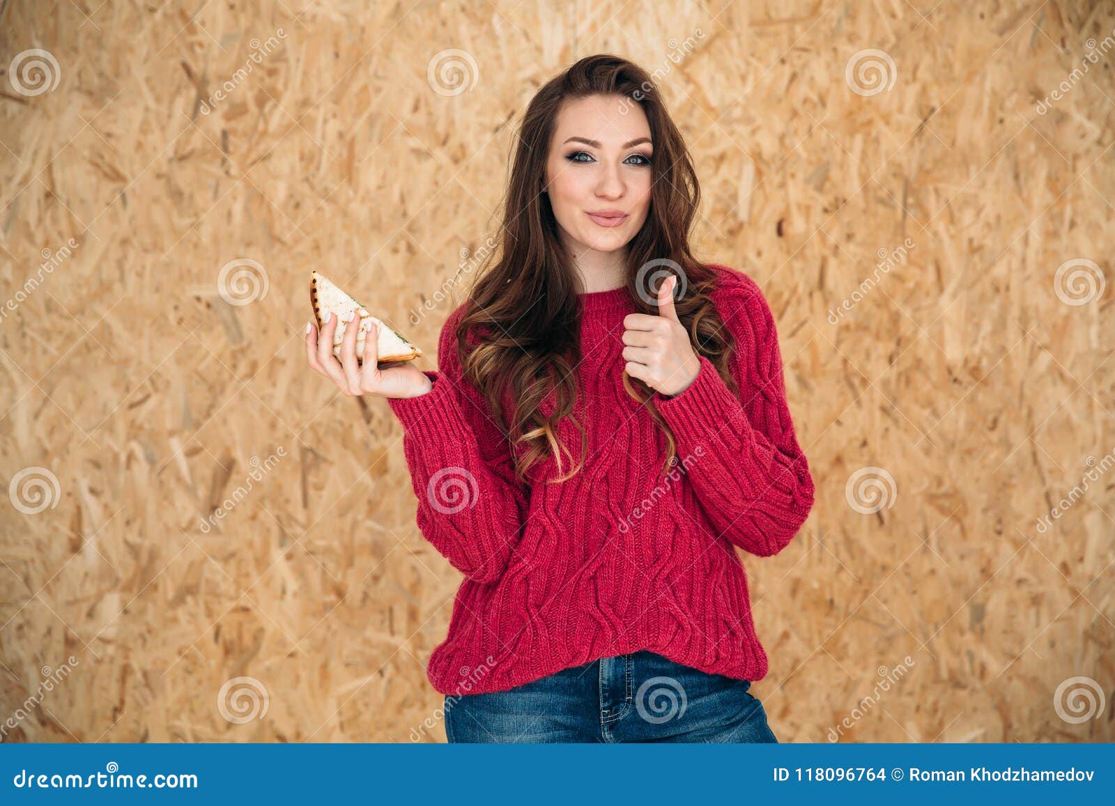 A Young Stylish Girl Smiles Gently and Shows Her Thumb Up, Meaning that Her  Sandwich is Very Tasty, and You Should Try Stock Photo - Image of  lifestyle, american: 118096764