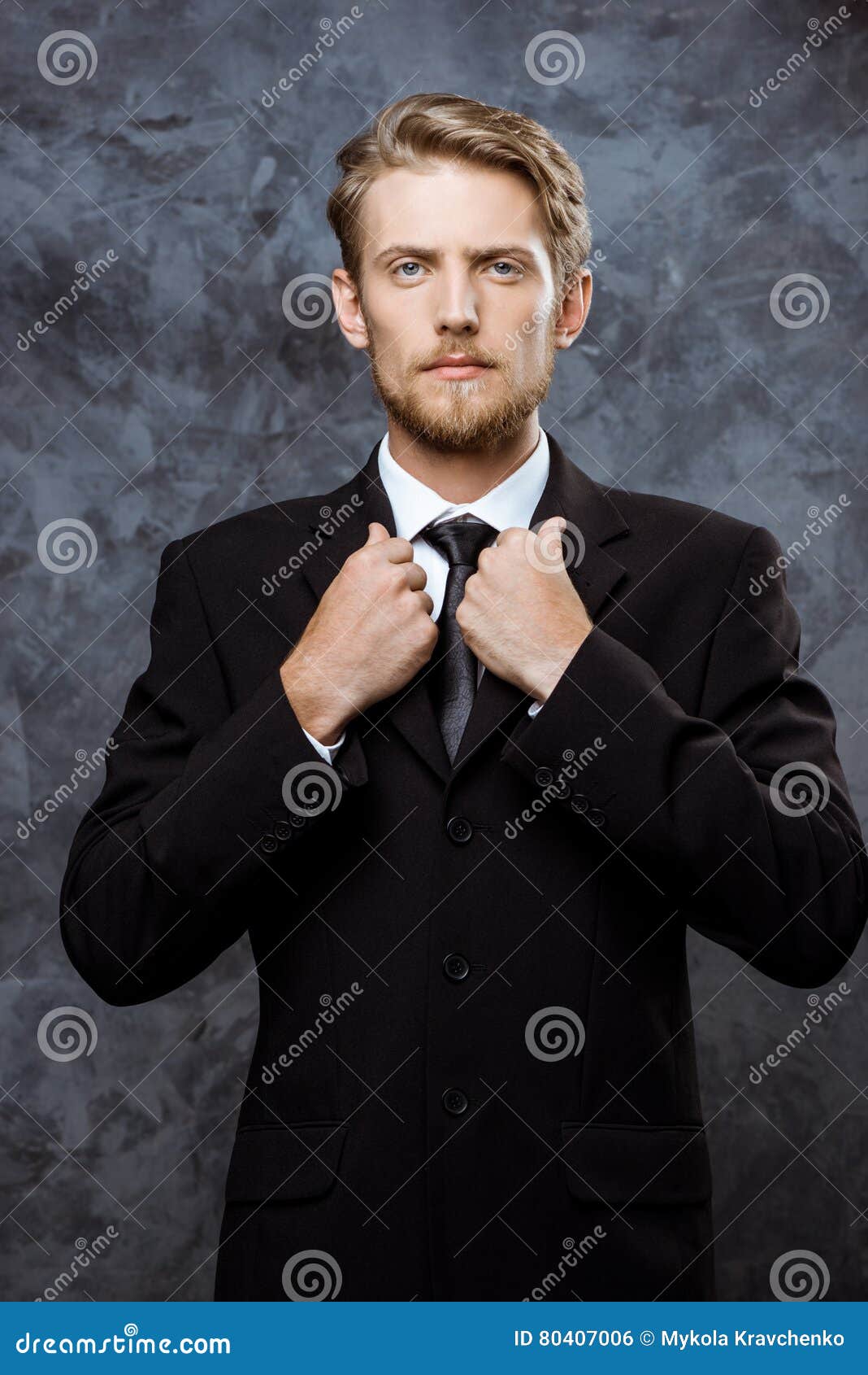 Young Successful Businessman Correcting Jacket Over Grey Background ...