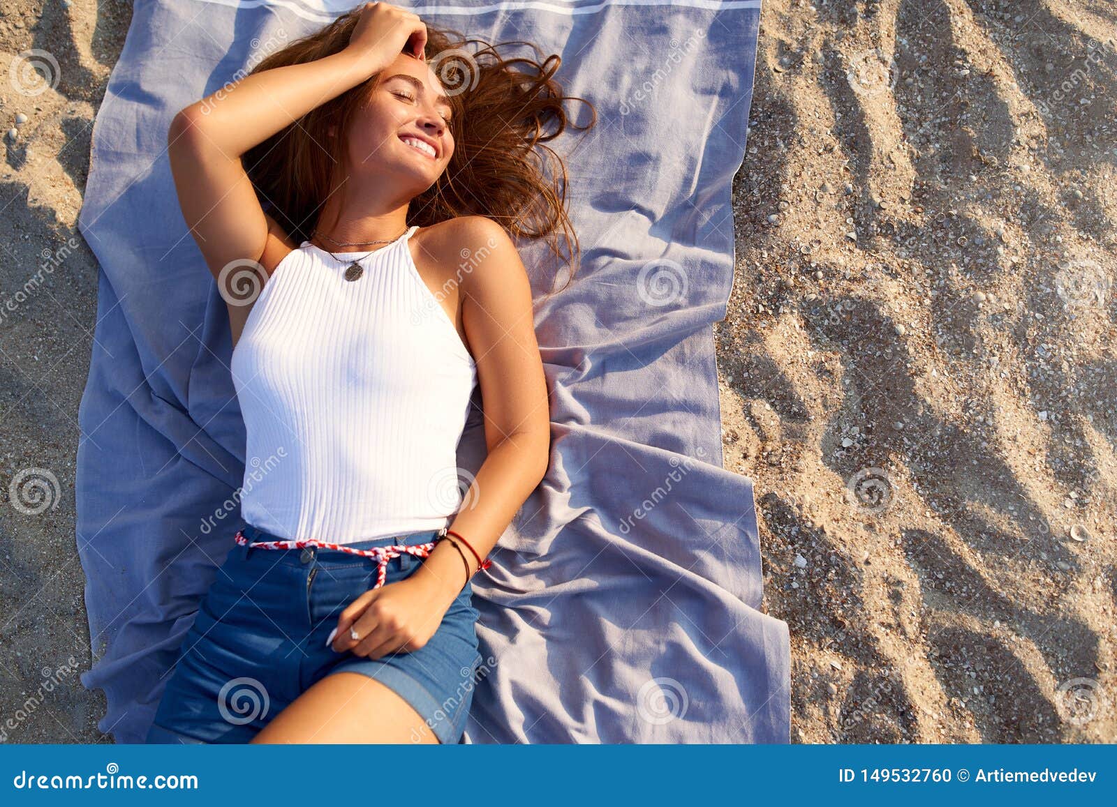 Young Tanned Pretty Woman Laying In The Sun On Beach Towel Attractive Stylish Fashionable