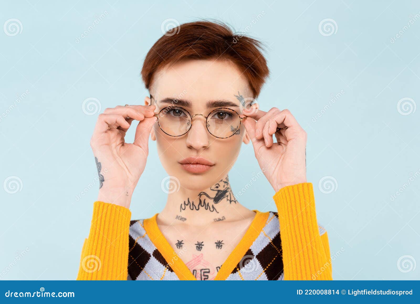Young Tattooed Woman Adjusting Glasses Isolated Stock Photo - Image of ...