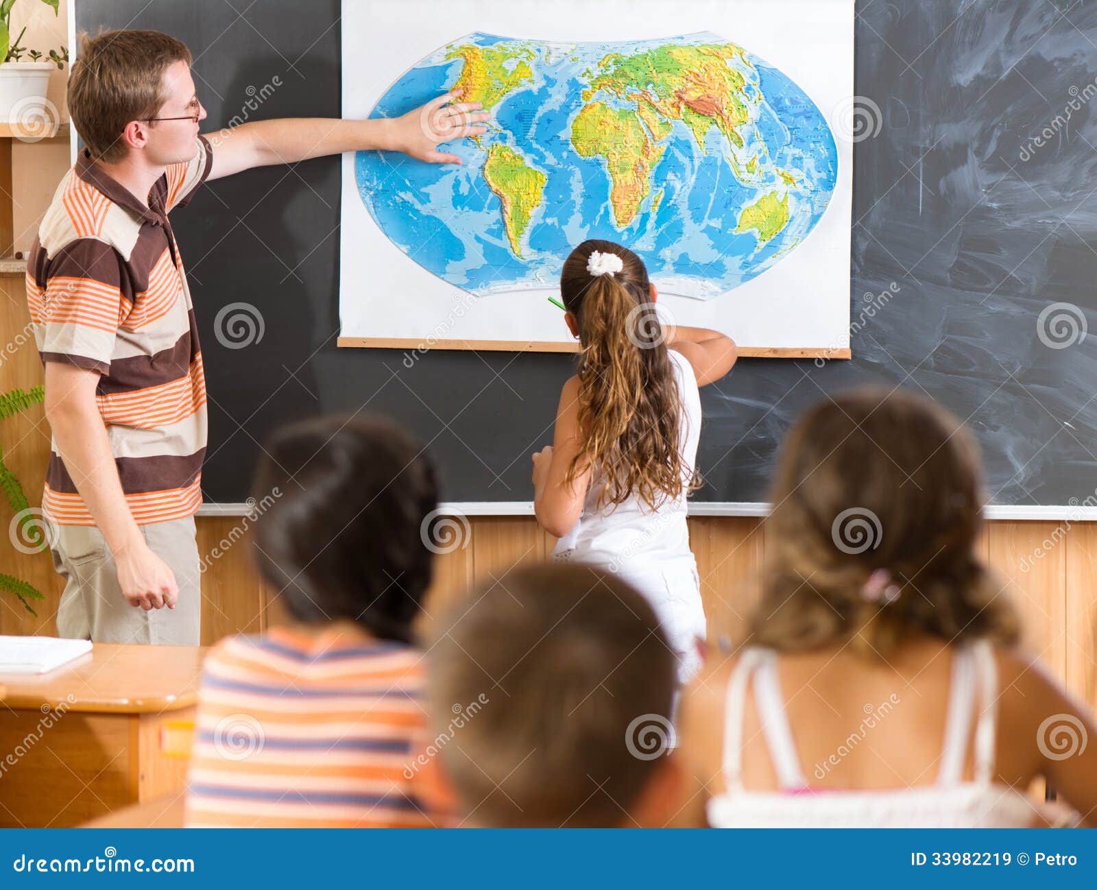 young teacher at geography lesson