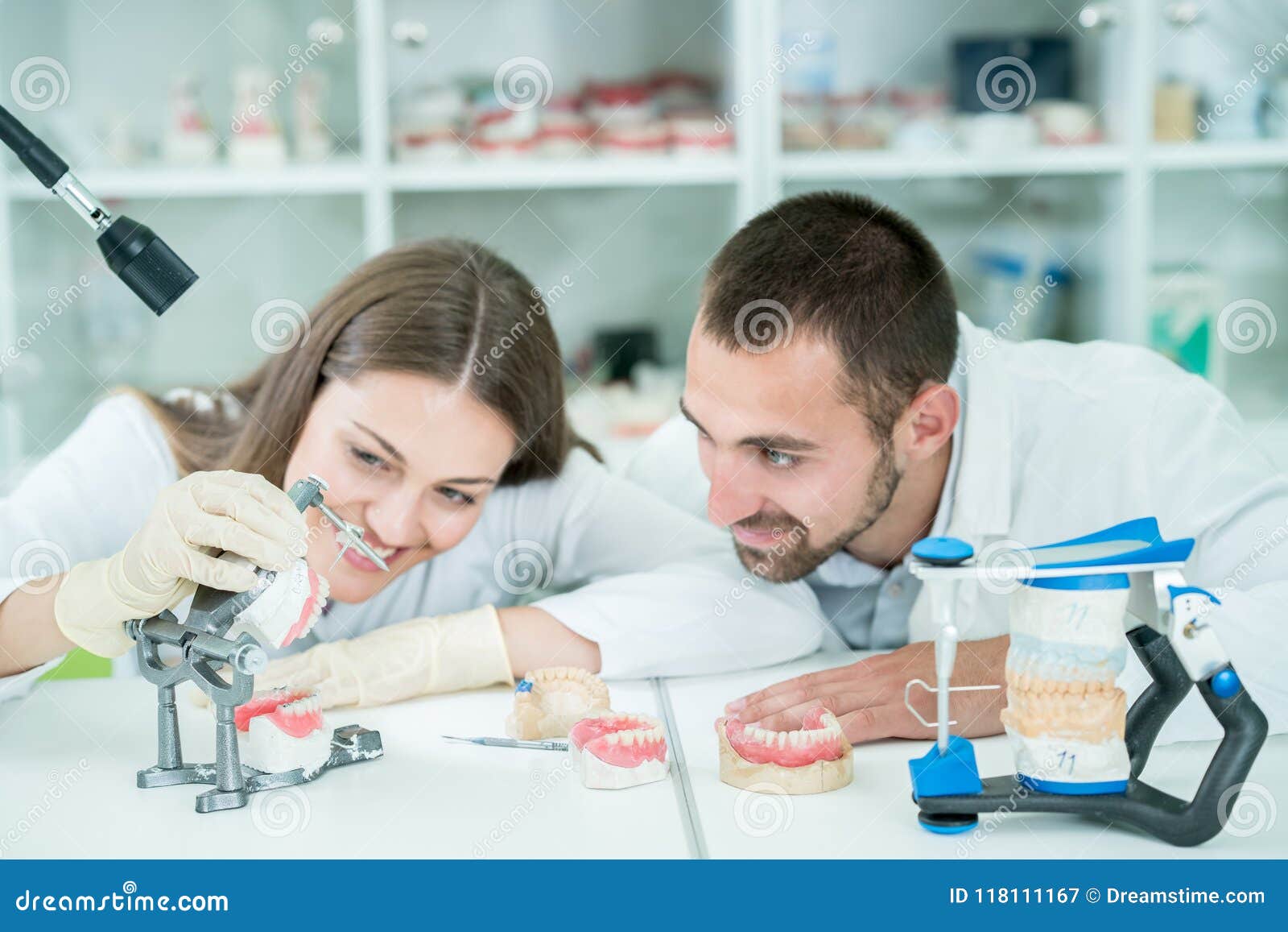 Young Team of Dental Technicians Making Teeth Prostetics. Process of Making Denture Stock Image
