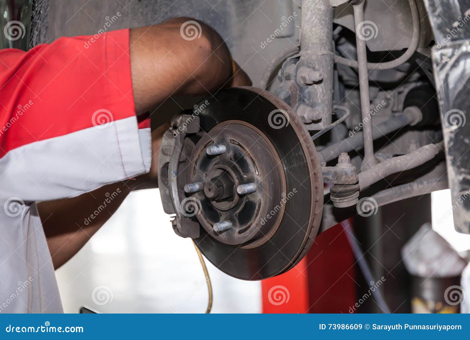 Young Technician Fixing Brake Disk in Car Garage Stock Image Image of