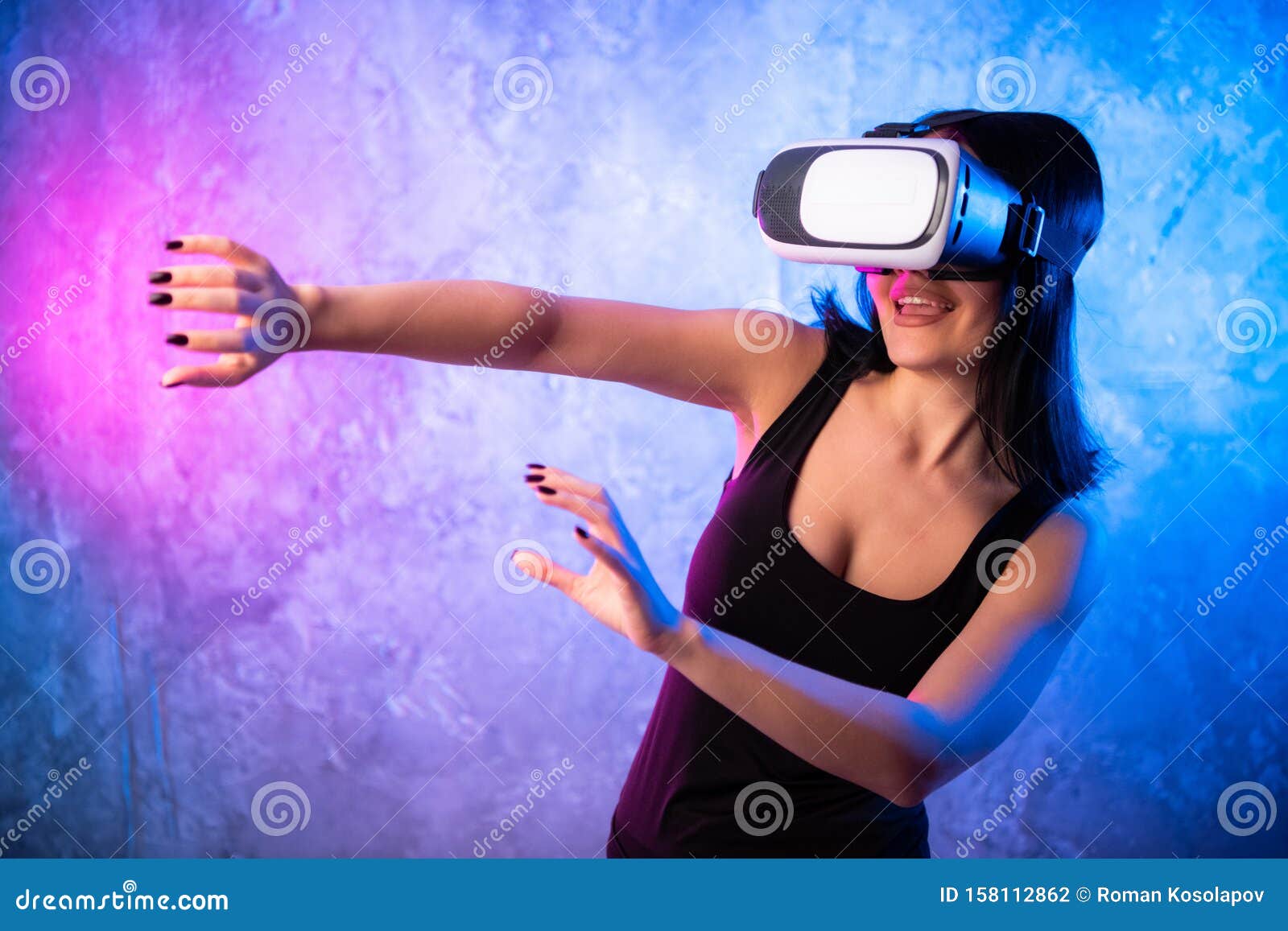 Young Teen Gamer Wearing VR Glasses Standing And Playing Virt