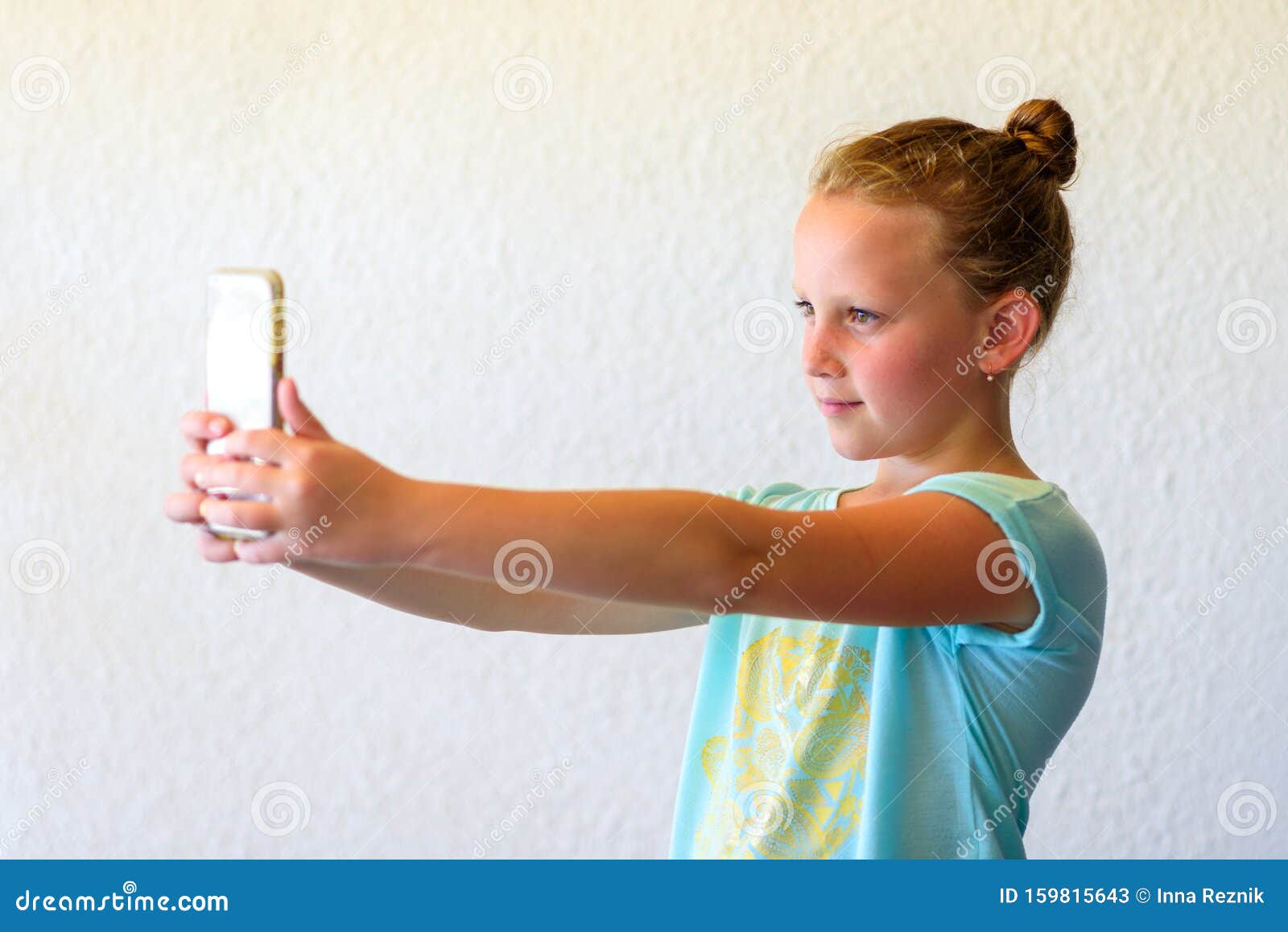 Teen Girl In Bed Using Smartphone High-Res Stock Photo 