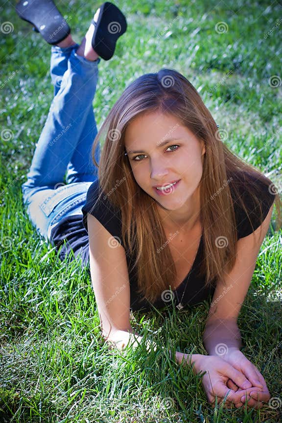Young Teenager Laying on Grass Stock Image - Image of perky, sensuality ...