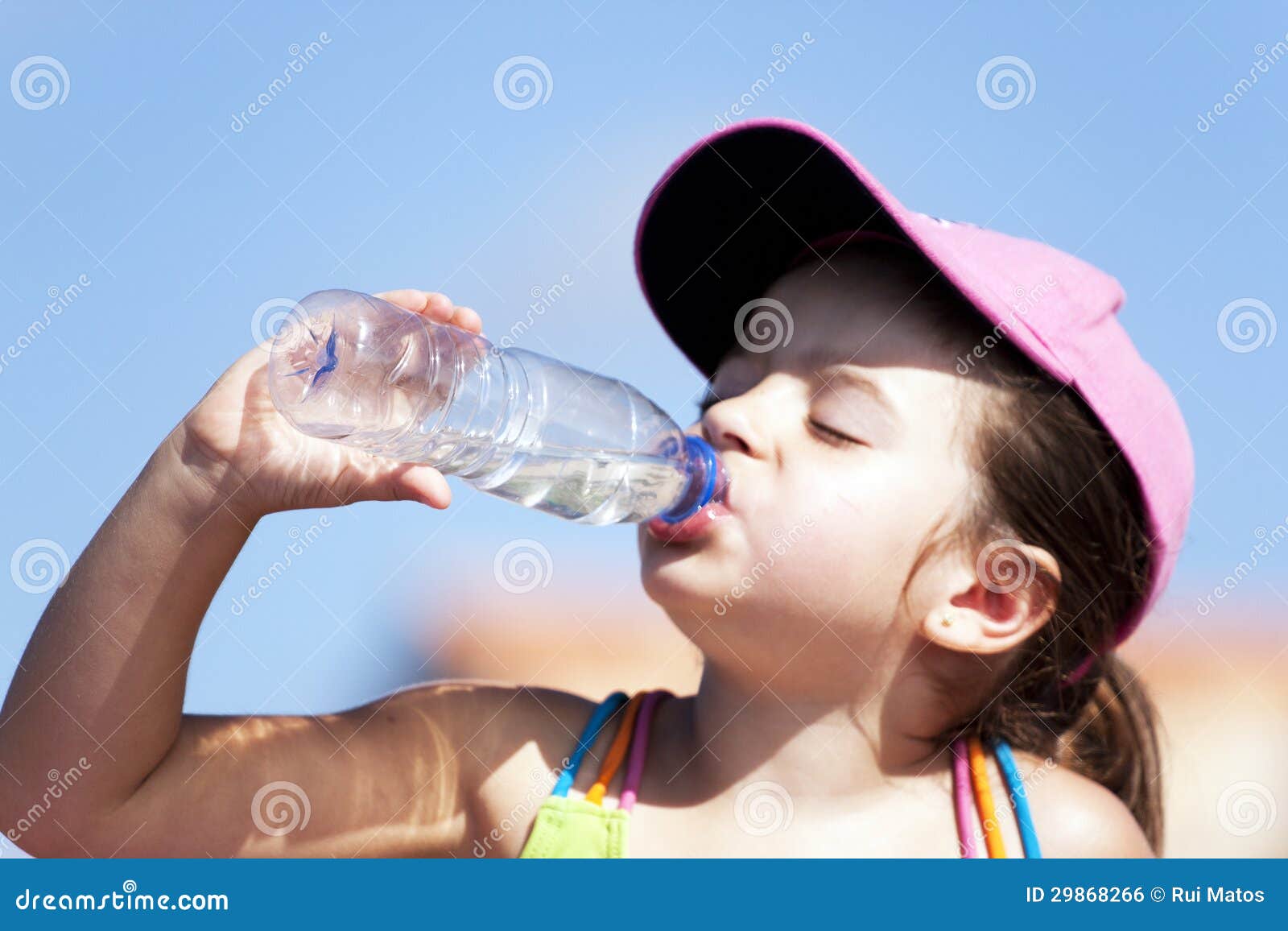 young girl drinking water