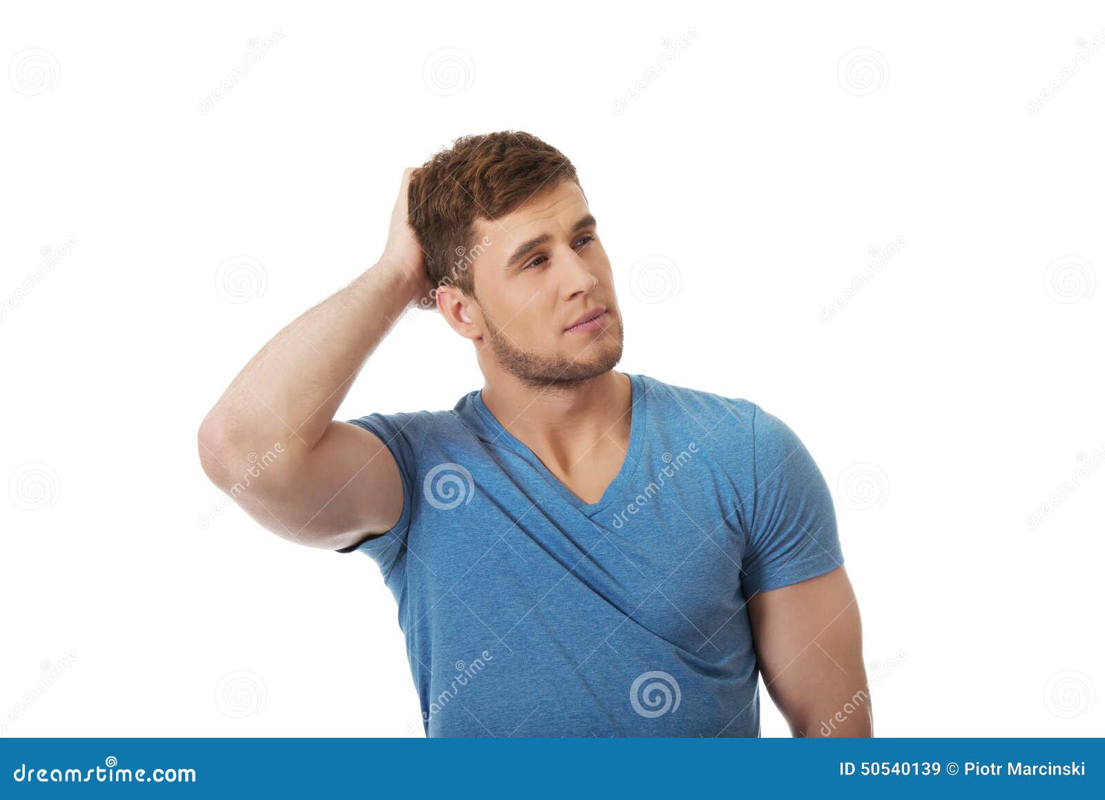 La Mano En La Cabeza La Otra En La Cintura Young Thoughtful Man with Hand Behind Head. Stock Image - Image of