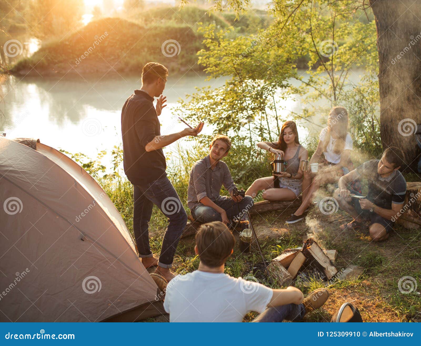 Young Tourist is Pulling the Wool Over Friends` Eyes Stock Photo