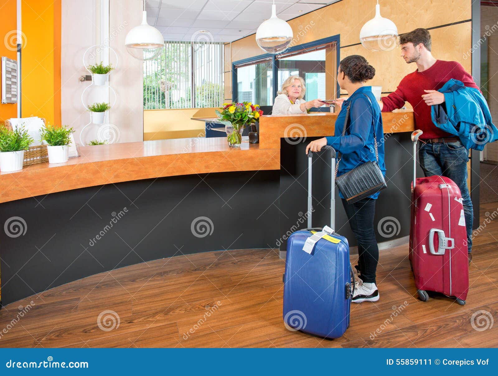 young travelers at hotel check in