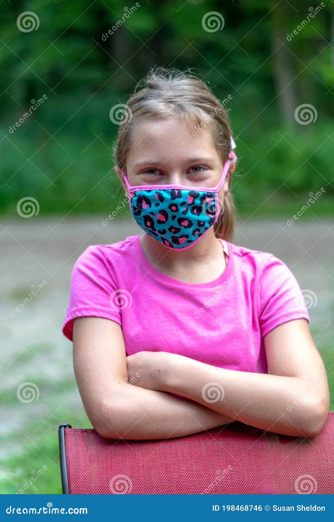 Young Tween Girl Sitting On A Pier Stock Photo