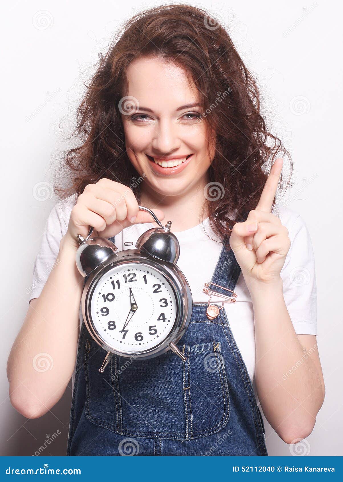 young woman with alarmclock